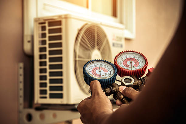Professional Air Conditioning Service technician working in Readyville, TN